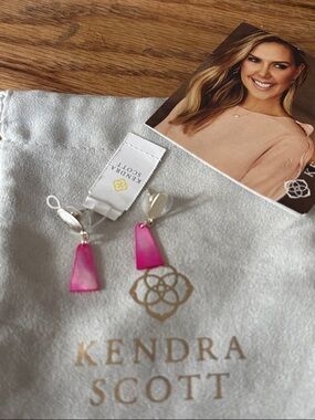 Kendra Scott Devin Gold Drop Earrings in a bright pink or dyed shell finish.
